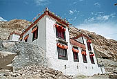 Ladakh - Tak Tok gompa, the main monastery halls with the characteristc red painted windows and woden balconies on white washed faades